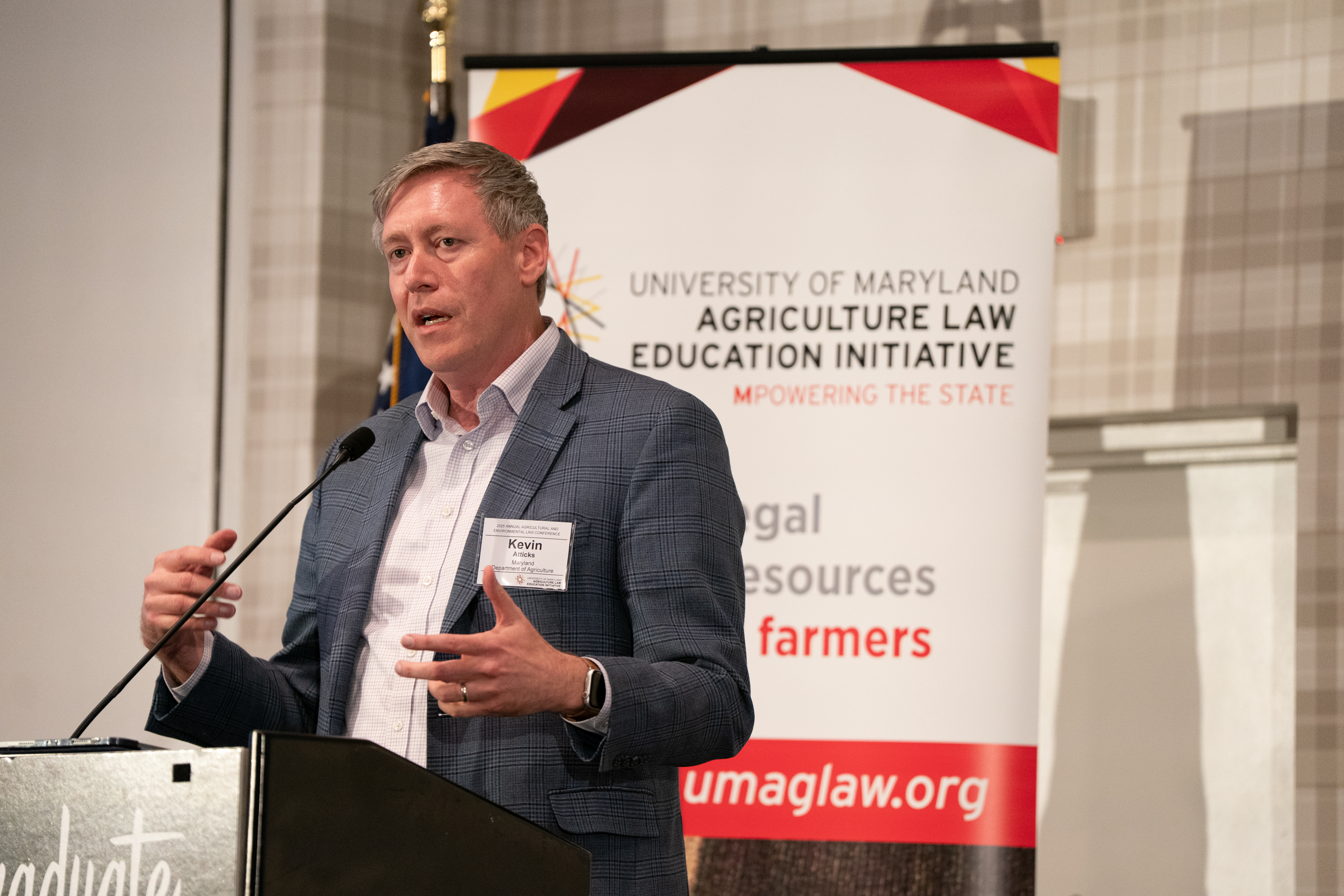 Maryland Secretary of Agriculture Kevin Atticks speaking at the podium at annual conference.