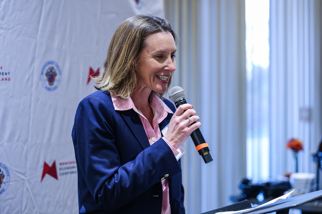 Board Chair for the Montgomery County Economic Development Corporation, Elana Fine, talks with microphone.